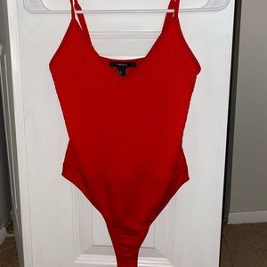 Red smocked bodysuit